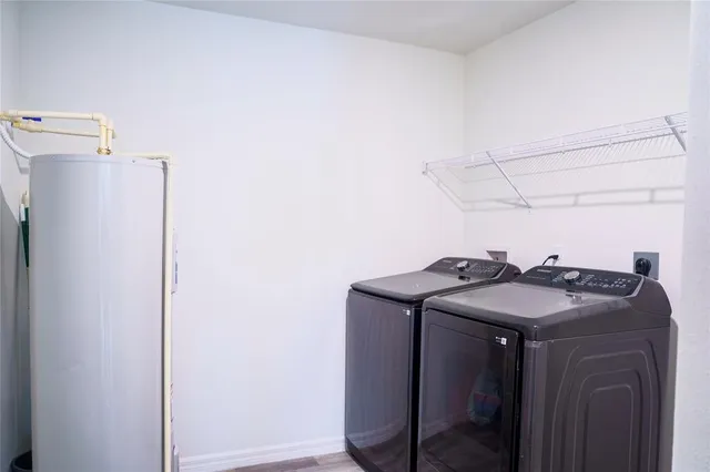 a utility room with dryer and washer