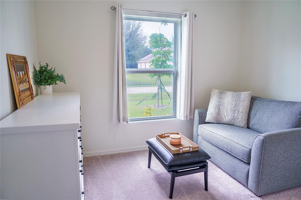 1229 Southwest San Antonio Avenue Port St. Lucie, FL 34953 - Photo 13 of 31 a living room with furniture and a window