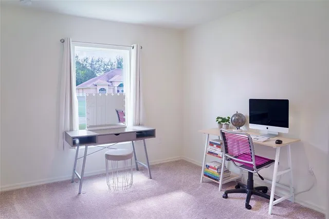 a view of a workspace with furniture