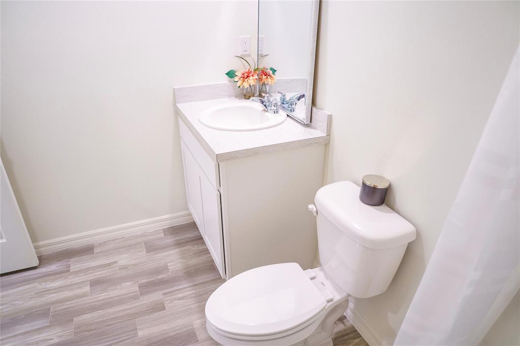 1229 Southwest San Antonio Avenue Port St. Lucie, FL 34953 - Photo 18 of 31 a bathroom with a sink toilet and mirror