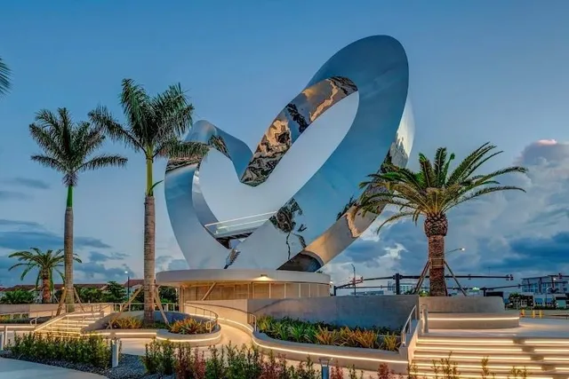 a table with chairs and a potted plant