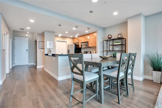 a view of a dining room with furniture window and wooden floor