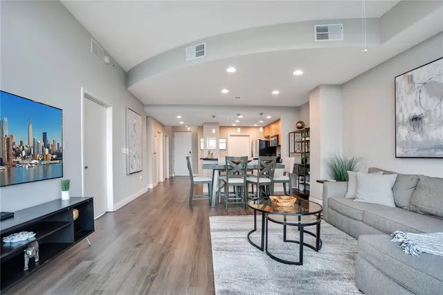 a view of a chairs and table in the balcony