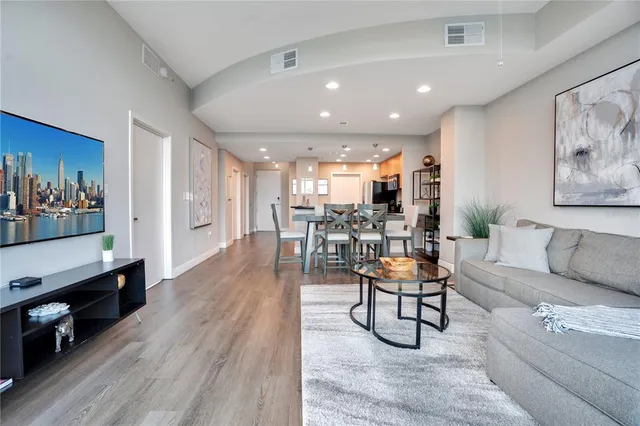 a large bed sitting in a bedroom next to a window