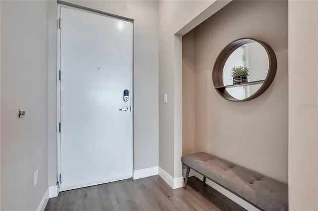 a view of kitchen with stainless steel appliances refrigerator stove microwave and cabinets