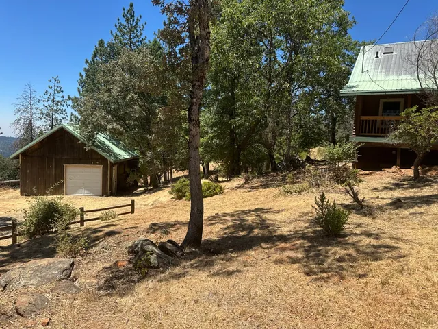 a view of yard covered with snow
