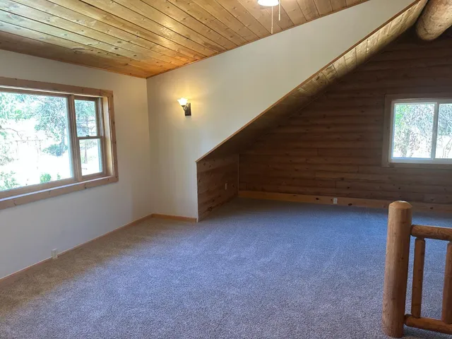 a bathroom with a shower a toilet and sink