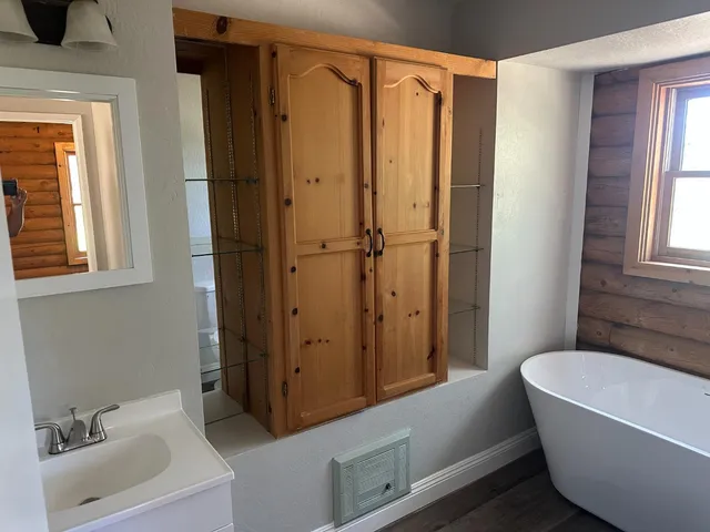 a view of a house with a tree