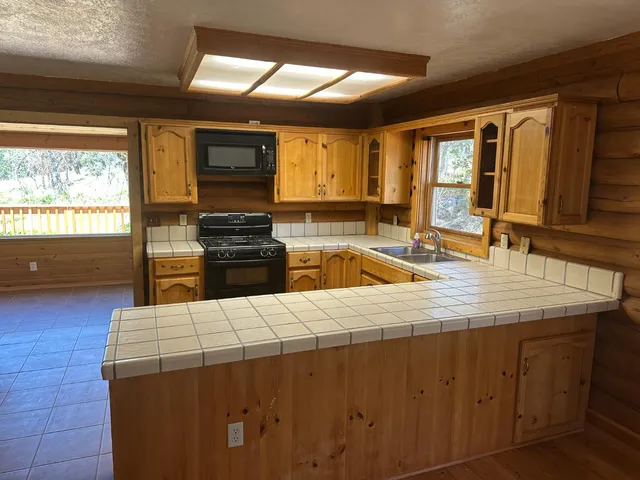 a backyard of a house with large trees