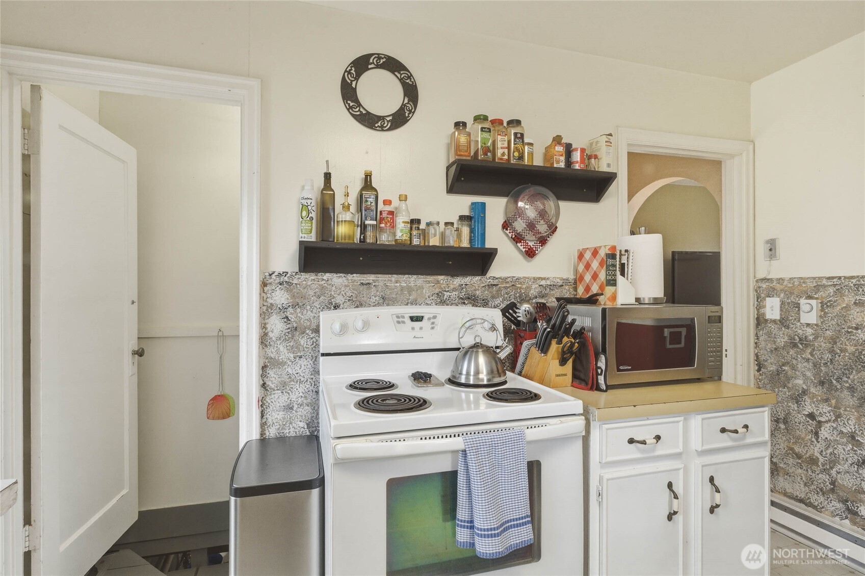 462 Beach Street Pateros, WA 98846 - Photo 8 of 30 a kitchen with a stove and a white cabinets