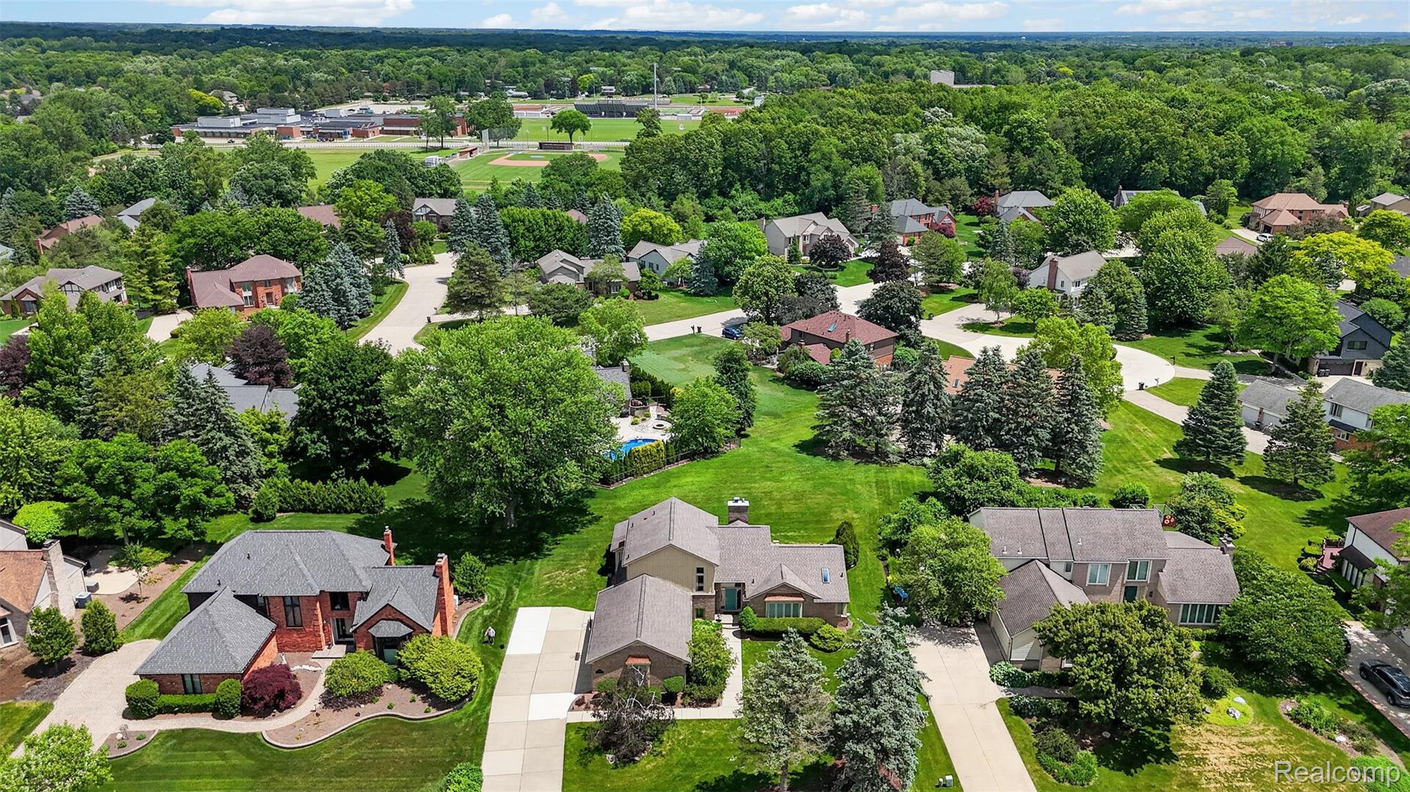 1236 Chaffer Drive Rochester, MI 48306 - Photo 69 of 76 Aerial perspective showcasing residential properties amidst mature trees and green landscaping