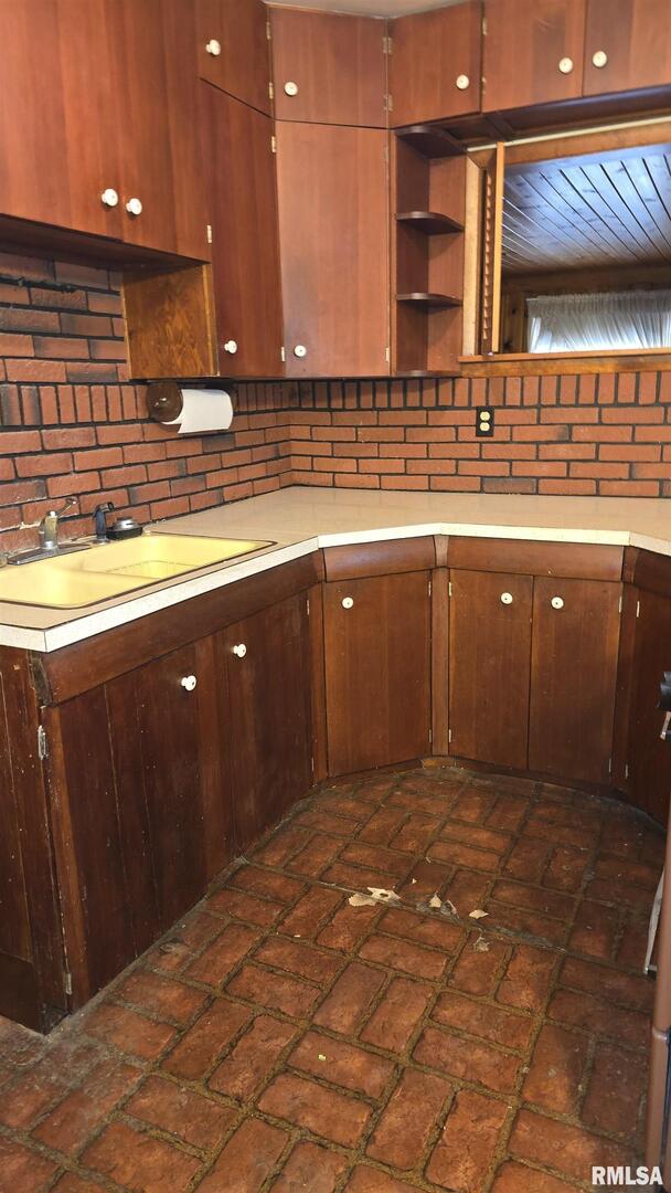 1028 Coyne Center Road Milan, IL 61264 - Photo 7 of 21 a kitchen with stainless steel appliances granite countertop a sink and cabinets