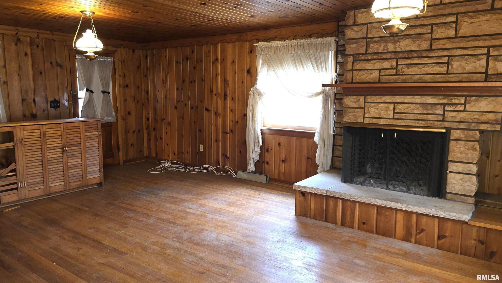 1028 Coyne Center Road Milan, IL 61264 - Photo 10 of 21 a view of an empty room with wooden floor