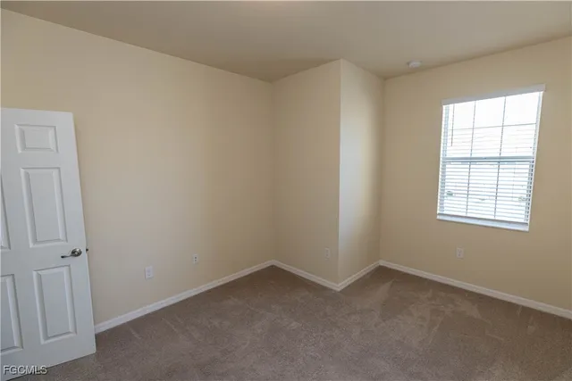 an empty room with window