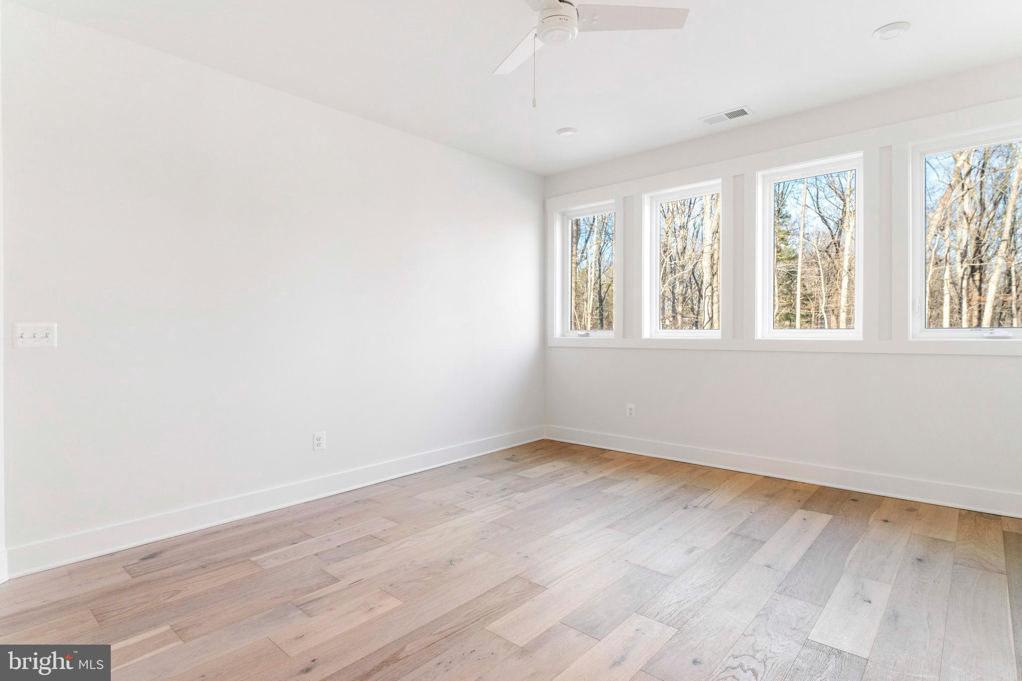 3321 Patuxent River Road Davidsonville, MD 21035 - Photo 53 of 81 an empty room with wooden floor and windows