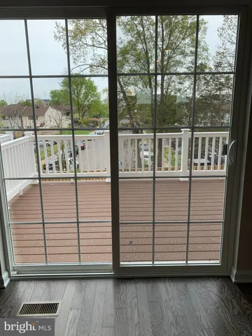 a view of a balcony with wooden floor