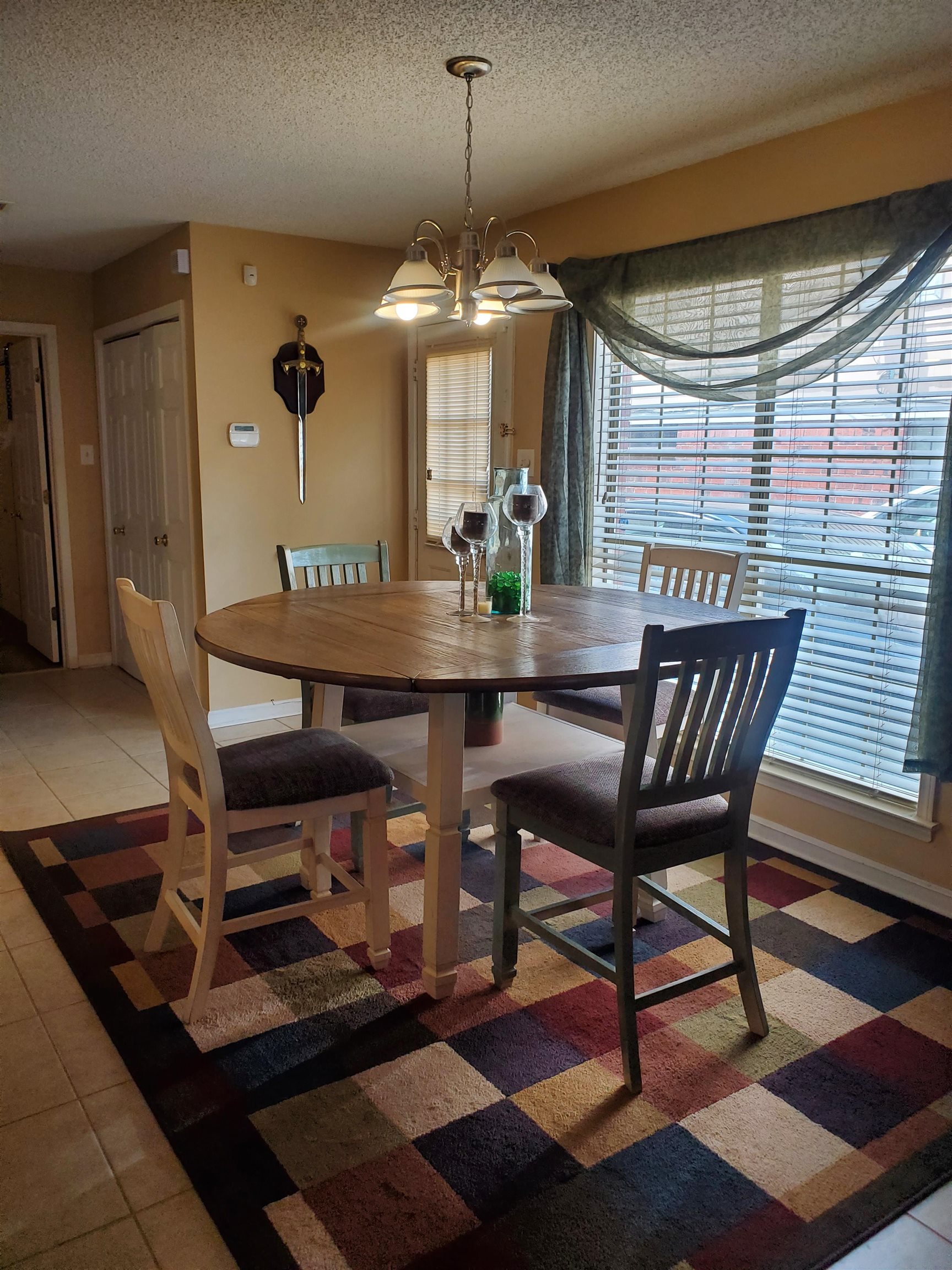 6769 Ross Ridge Drive Memphis, TN 38141 - Photo 12 of 25 a dining room with furniture and window