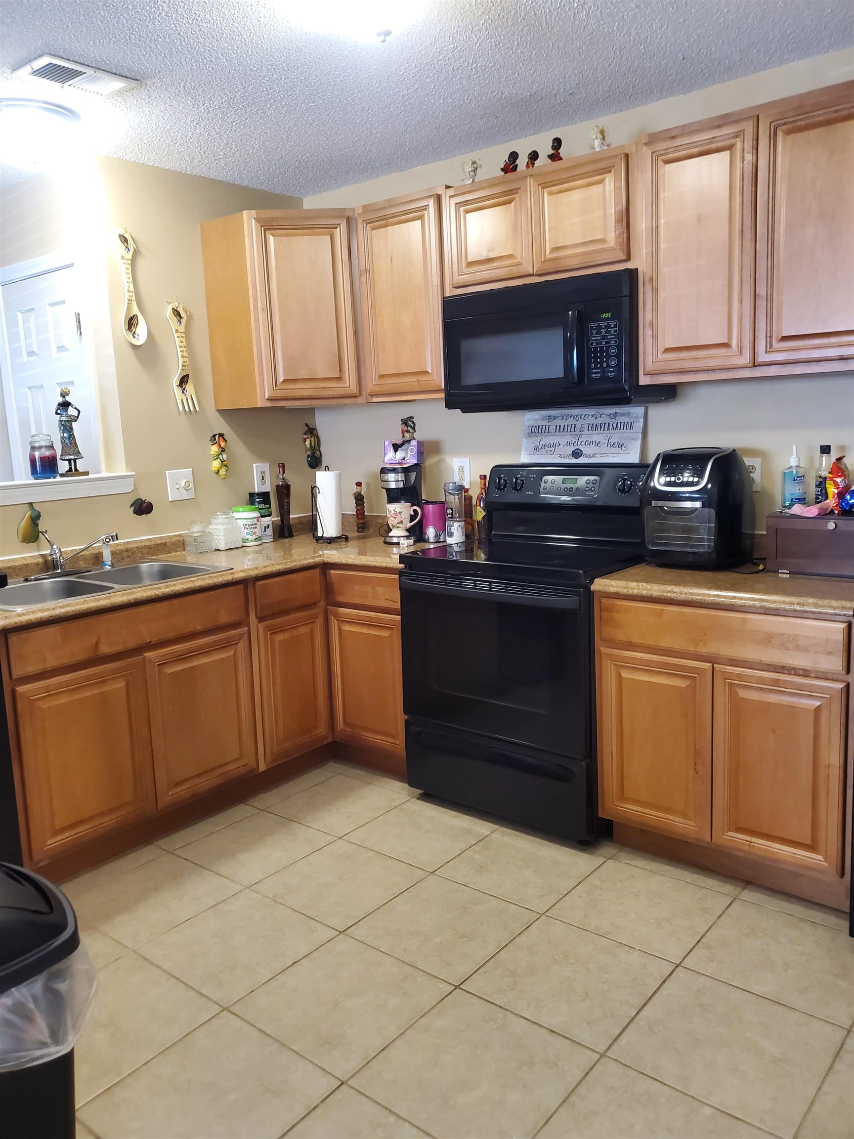 6769 Ross Ridge Drive Memphis, TN 38141 - Photo 9 of 25 a kitchen with a sink a stove and cabinets