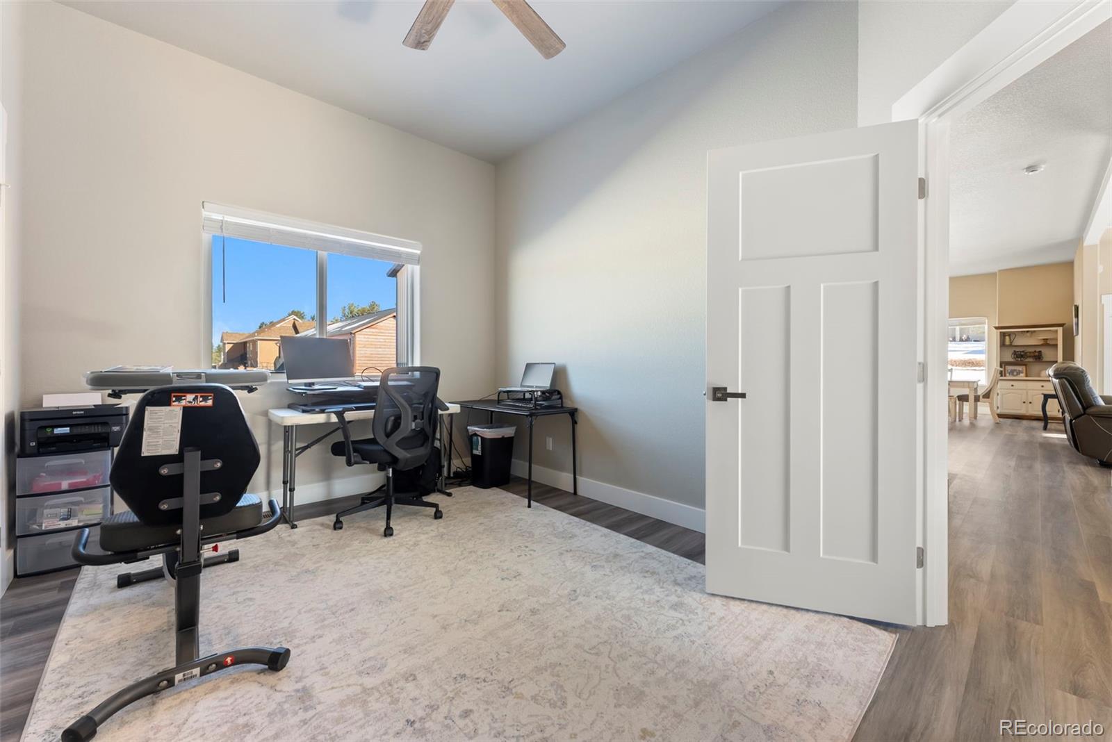 489 Duesouth Road Florissant, CO 80816 - Photo 23 of 40 a view of a workspace with furniture and a livingroom