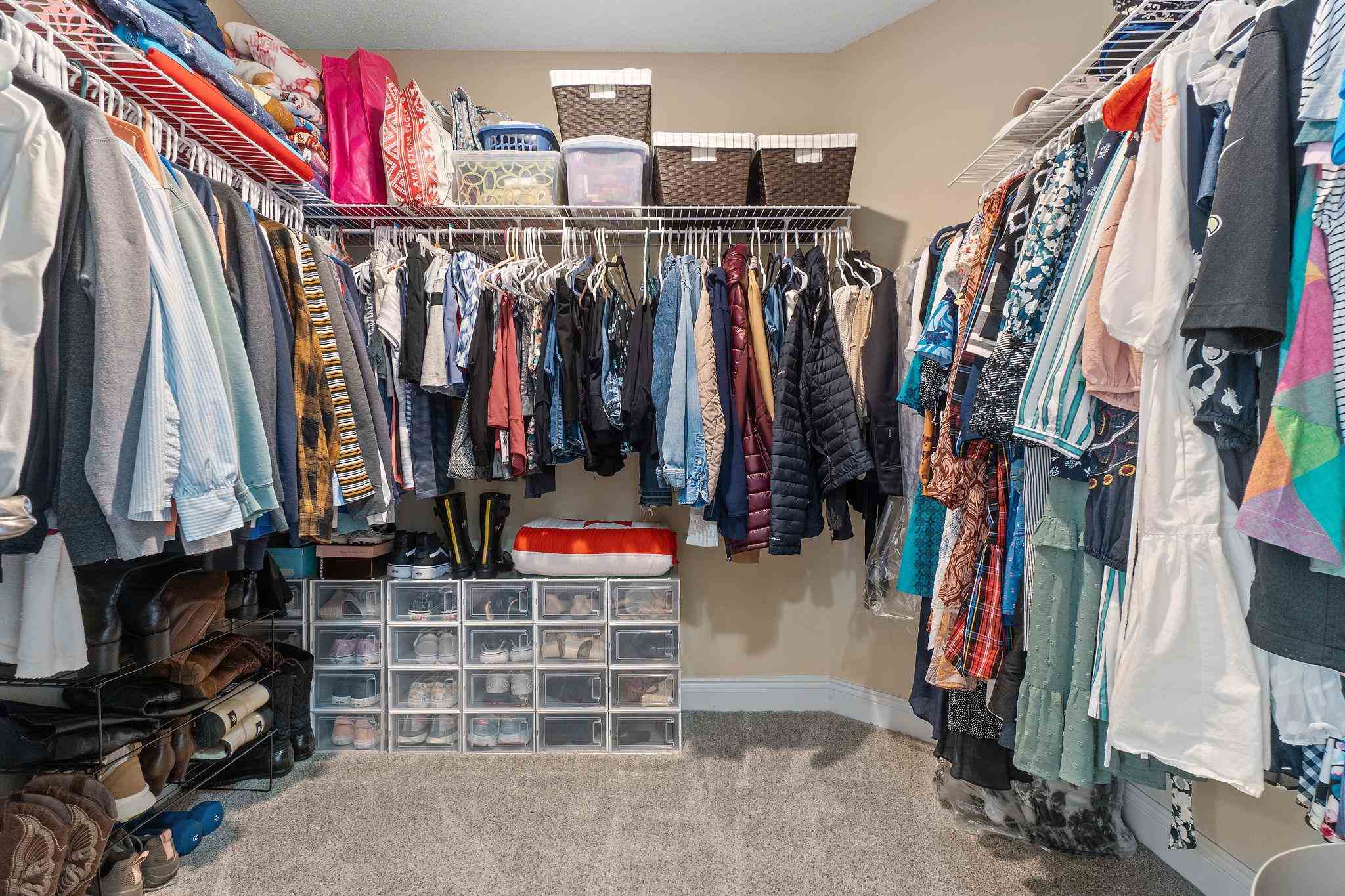 4248 Chittingham Drive Pace, FL 32571 - Photo 27 of 43 a view of walk in closet with clothes
