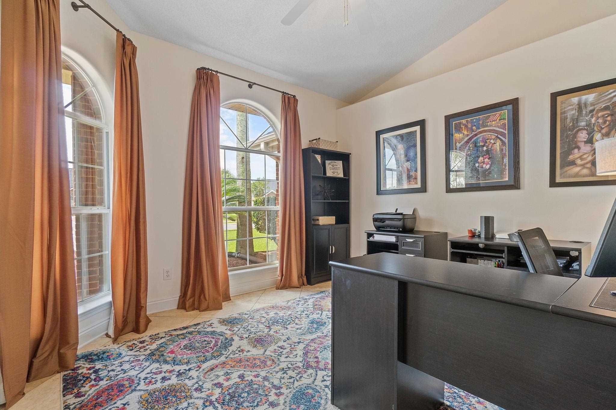 4248 Chittingham Drive Pace, FL 32571 - Photo 6 of 43 a view of a workspace with furniture and a window