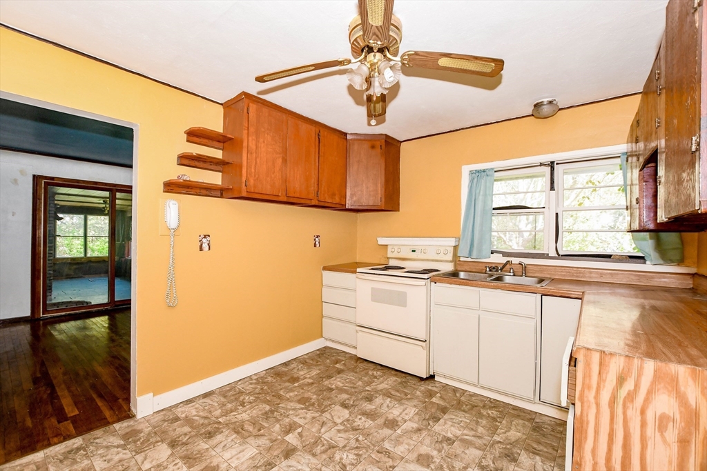 6 Gilbert Way Wareham, MA 02571 - Photo 18 of 41 a kitchen with a stove a sink and a refrigerator