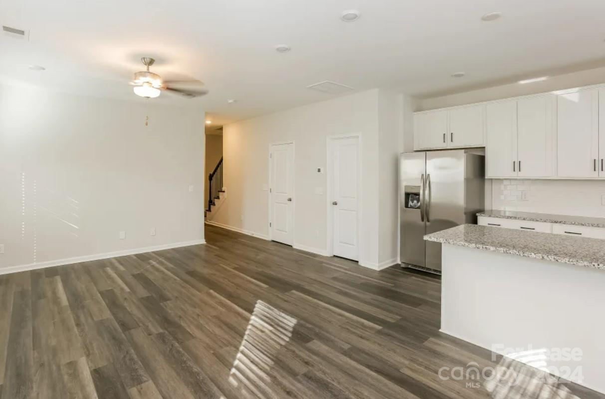 2002 Commerce Drive Monroe, NC 28110 - Photo 5 of 7 a view of a kitchen with a sink and a refrigerator