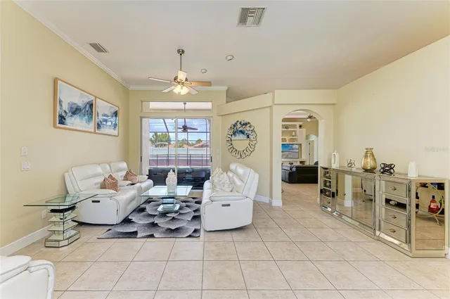 a dining room with furniture and window