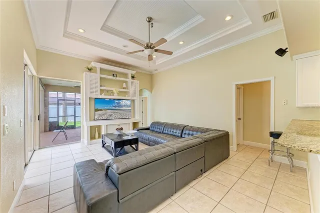 a view of a livingroom with workspace and a window