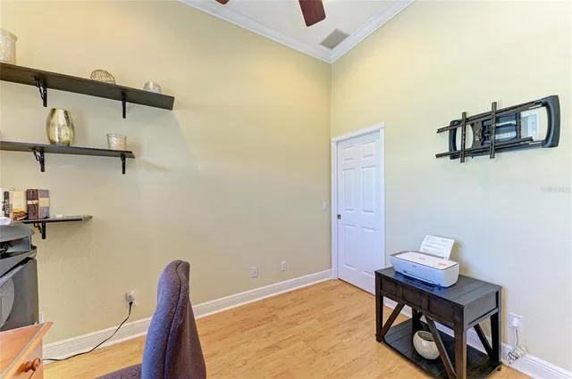 a view of a kitchen with kitchen island granite countertop a refrigerator and a sink