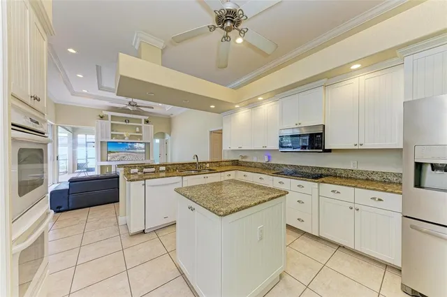 a balcony with furniture and a potted plant