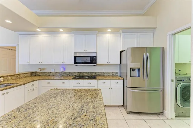 a view of a backyard with a patio and swimming pool