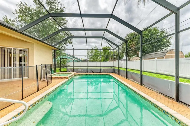 a bedroom with a bed and a ceiling fan