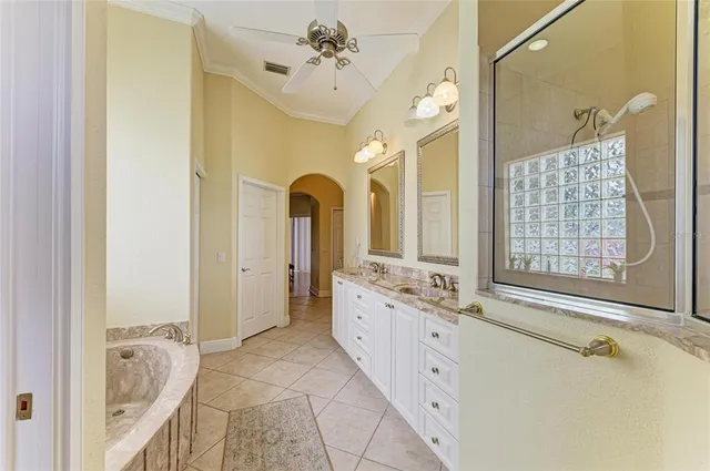 a bathroom with a granite countertop toilet a sink and a mirror
