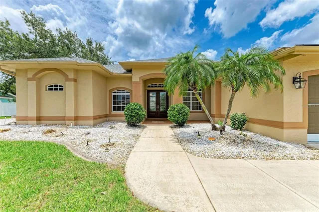 a room with a bed and a chandelier