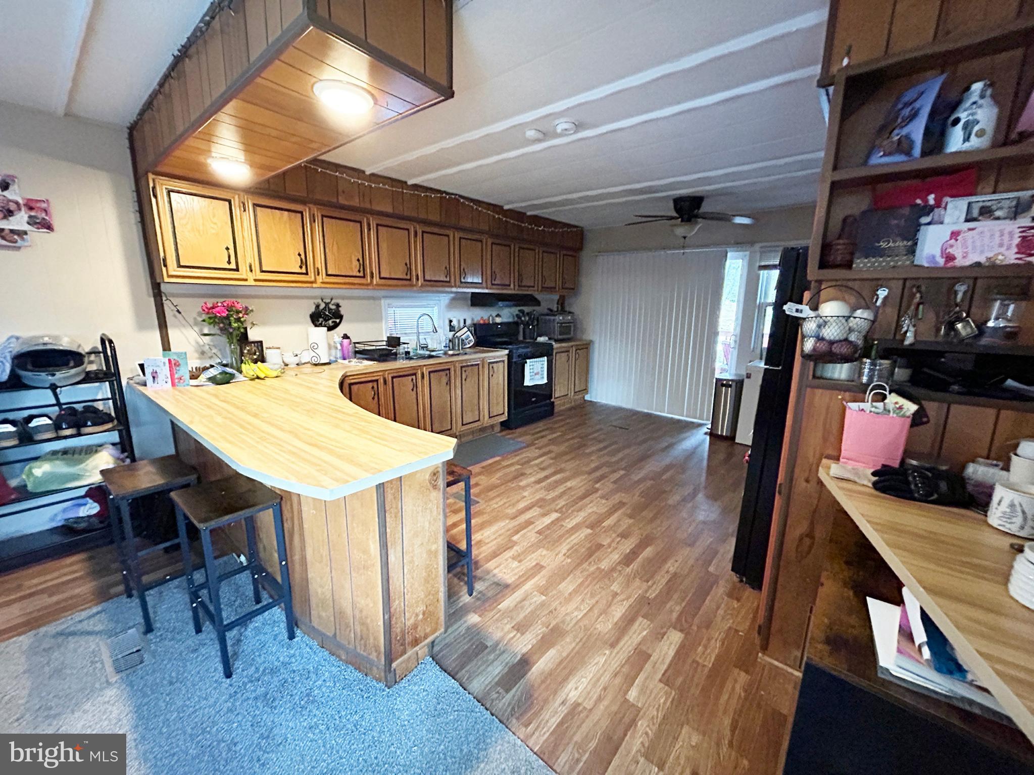 4743-4745 Chambersburg Road Biglerville, PA 17307 - Photo 15 of 101 a kitchen with stainless steel appliances granite countertop a sink a stove and a wooden floors