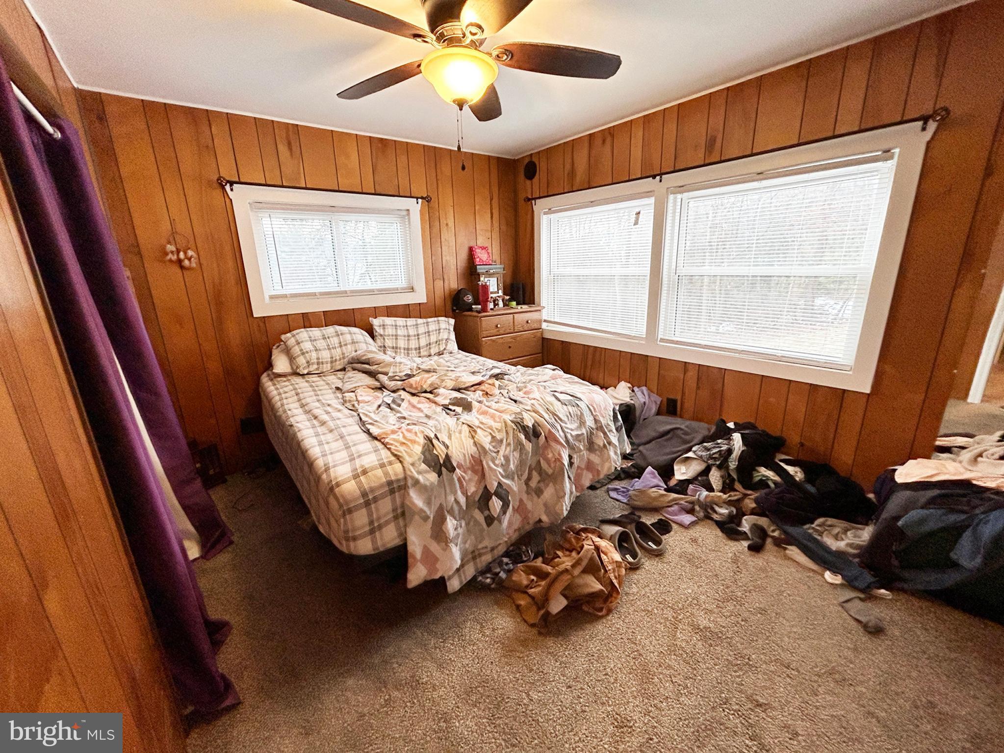 4743-4745 Chambersburg Road Biglerville, PA 17307 - Photo 33 of 101 a bed sitting in a bedroom next to a window