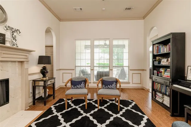 a living room with furniture and a rug