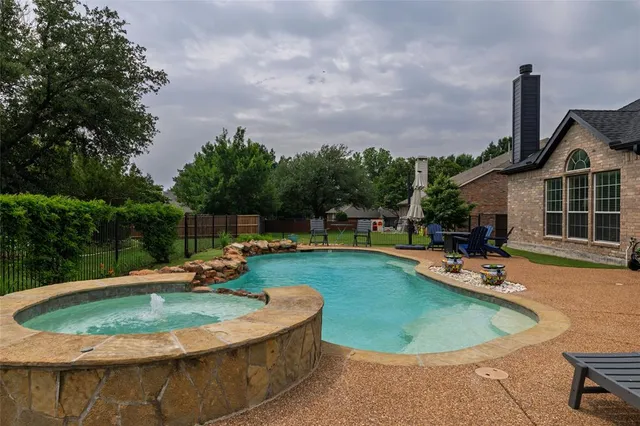 a view of a swimming pool with a patio