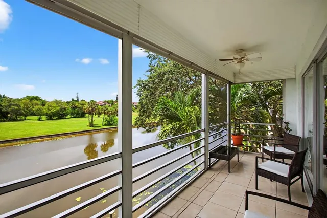 a view of a balcony with chairs