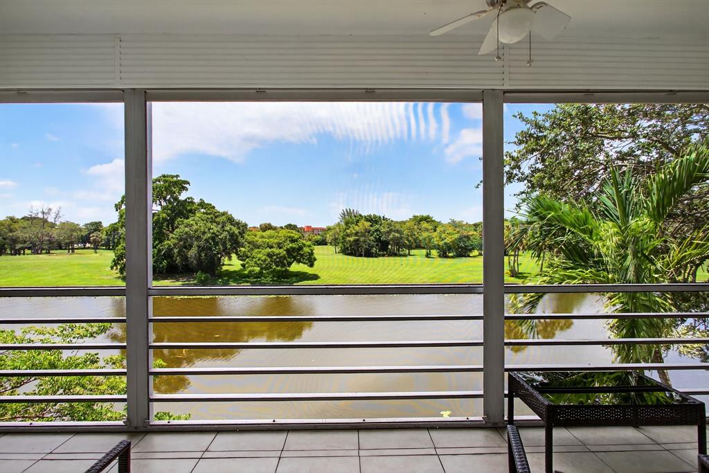3551 Inverrary Drive, Unit 312 Lauderhill, FL 33319 - Photo 20 of 42 a view of a room with a large window and wooden floor
