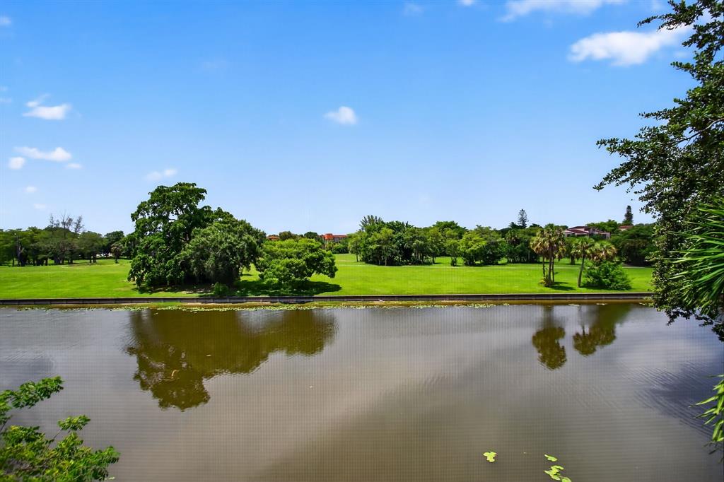 3551 Inverrary Drive, Unit 312 Lauderhill, FL 33319 - Photo 21 of 42 a view of a lake with a house in the background