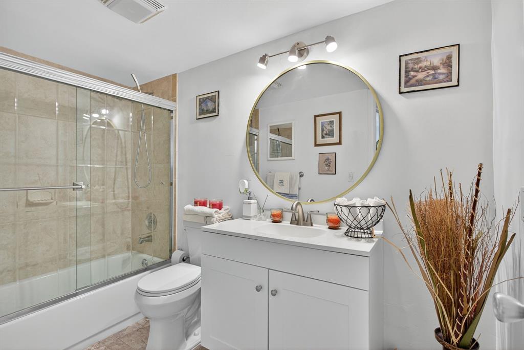 3551 Inverrary Drive, Unit 312 Lauderhill, FL 33319 - Photo 3 of 42 a bathroom with a sink mirror and toilet