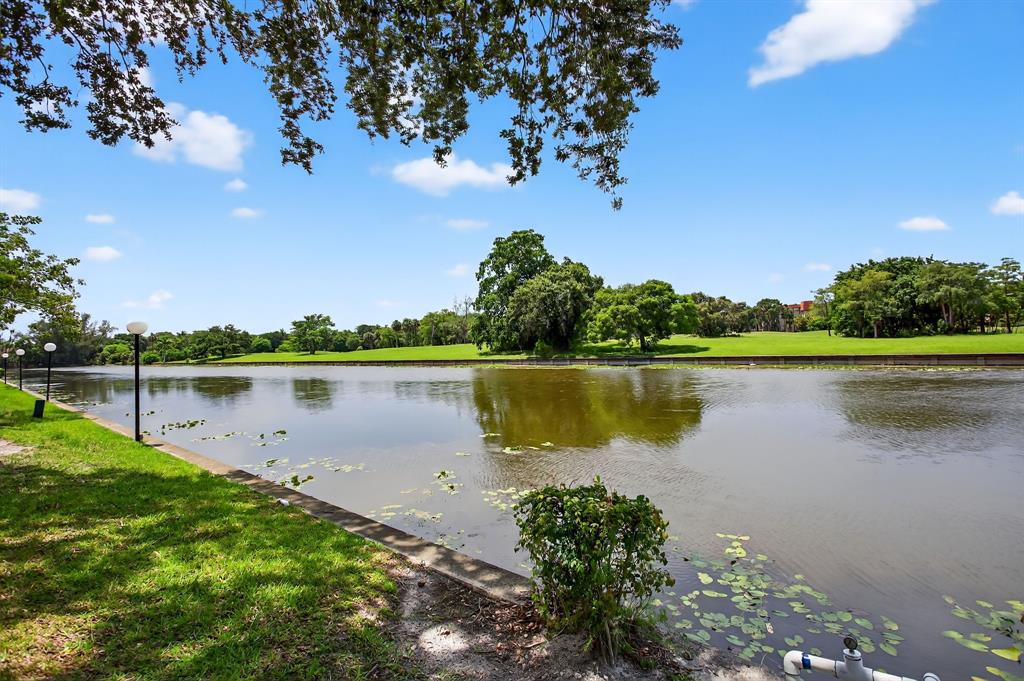 3551 Inverrary Drive, Unit 312 Lauderhill, FL 33319 - Photo 31 of 42 a view of a lake with a big yard