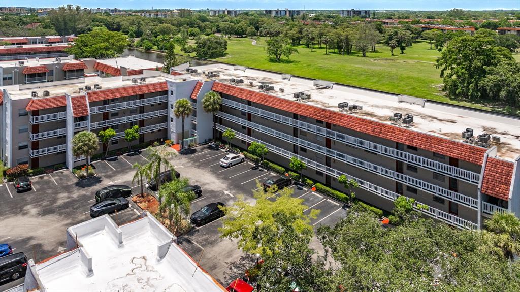 3551 Inverrary Drive, Unit 312 Lauderhill, FL 33319 - Photo 40 of 42 an outdoor view of a garden with lawn chairs