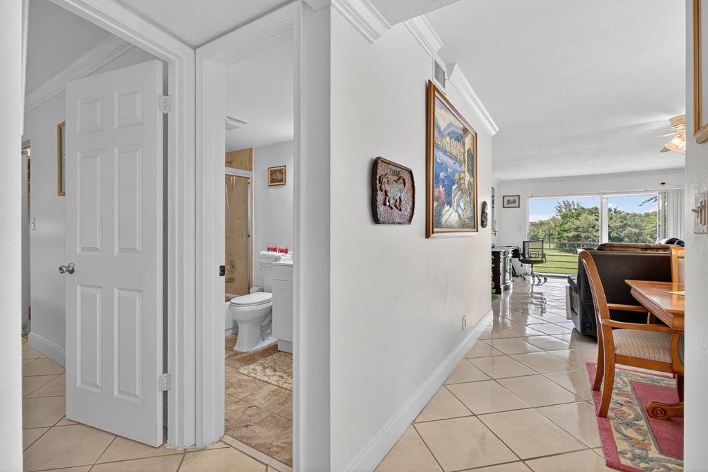 3551 Inverrary Drive, Unit 312 Lauderhill, FL 33319 - Photo 8 of 42 a view of a hallway with bathroom and front door