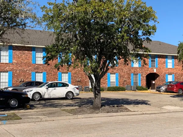 a view of a car parked on the side of a street