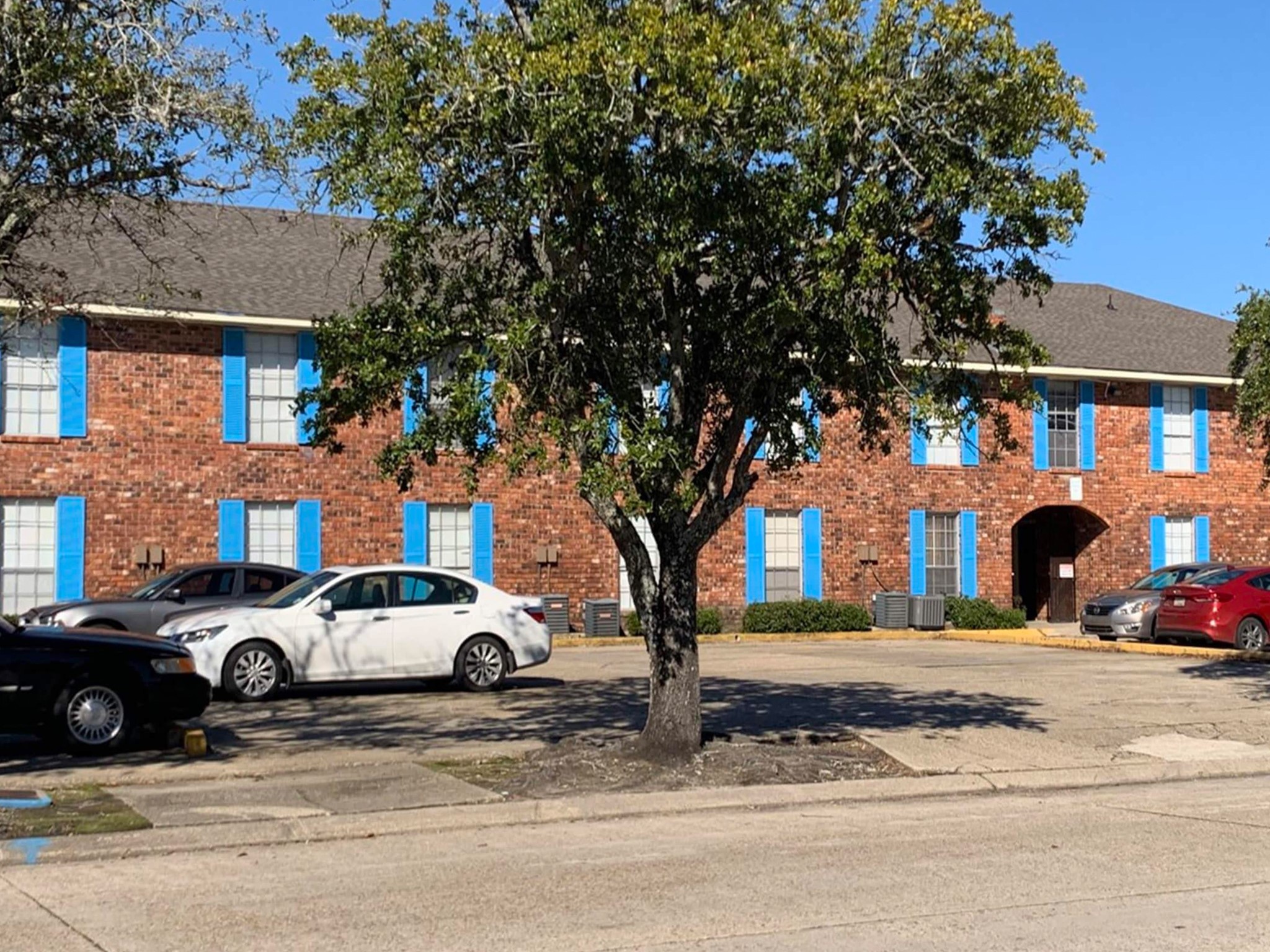 6752 Titian Avenue, Unit 50 Baton Rouge, LA 70806 - Photo 5 of 6 a view of a car parked on the side of a street