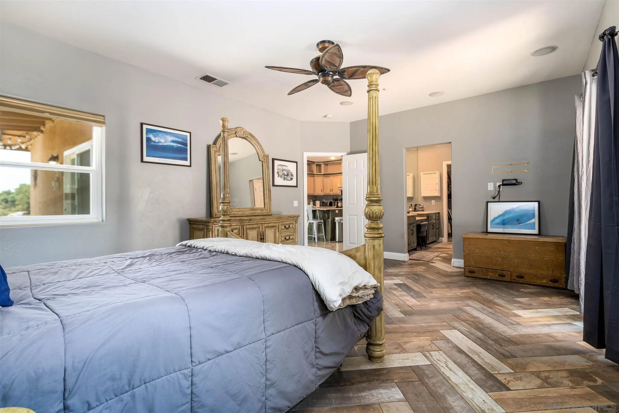 19139 Split Rock Road Ramona, CA 92065 - Photo 14 of 29 a bed room with a bed and a chandelier