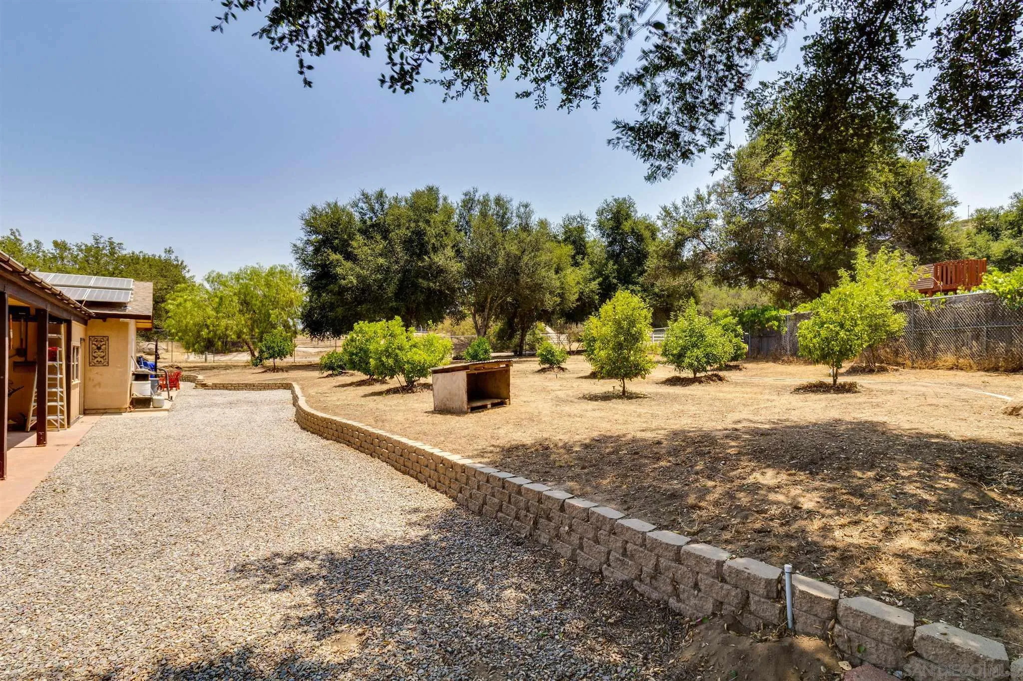 19139 Split Rock Road Ramona, CA 92065 - Photo 24 of 29 a street view with large trees